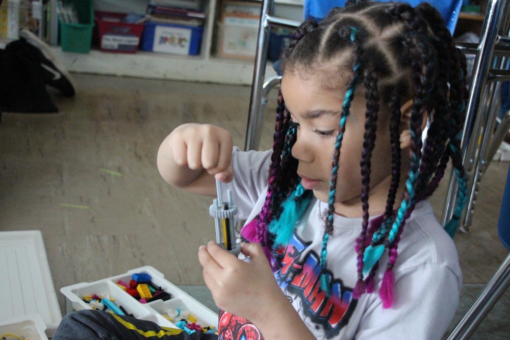 Prekindergarten Student works on robotics