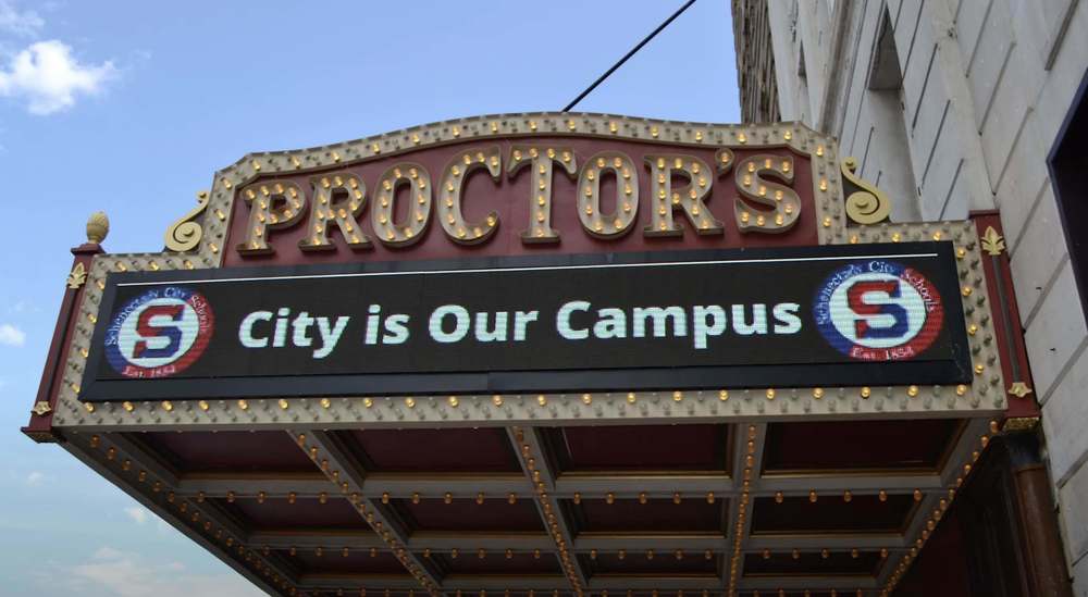 City as our campus sign above proctors