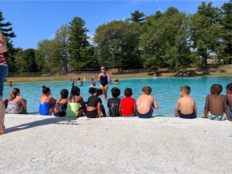 2nd grade students dip toes in pool
