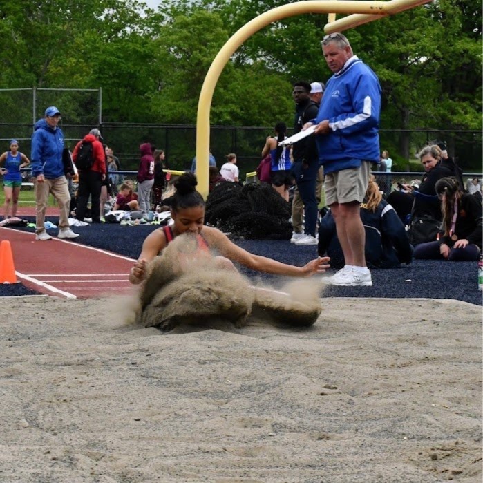 long jumper lands in sand