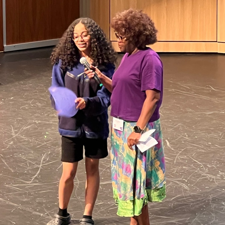 student presents her mask