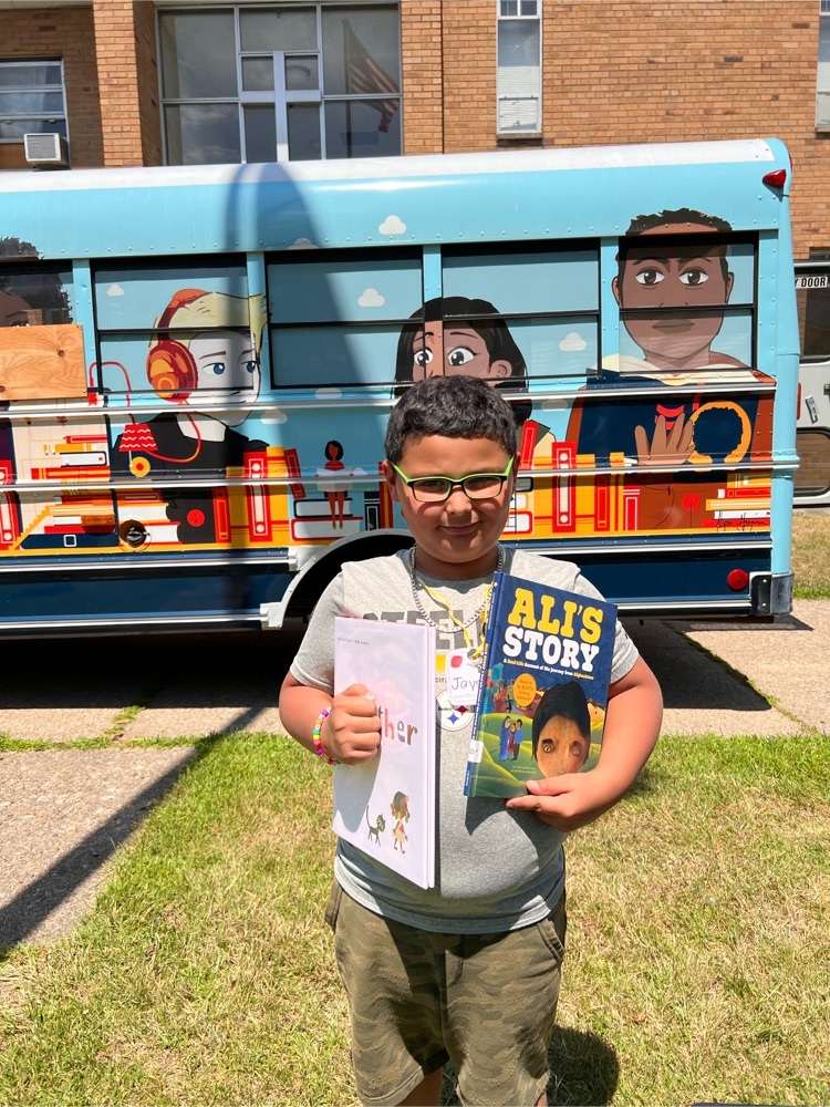 boy holding books