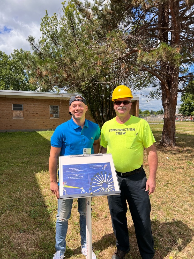 local author and construction teacher pose